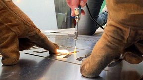 Blowtorch flame on aluminium stencil