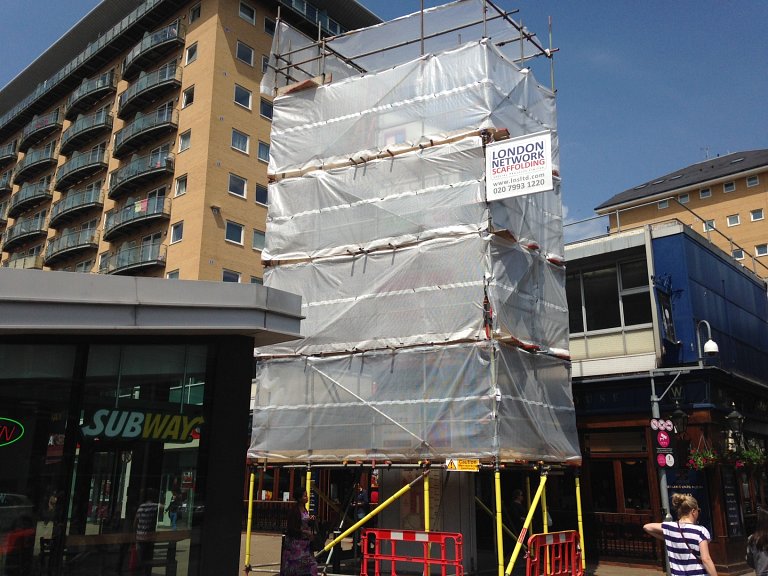 Scaffolding surrounding one of the large monoliths at The Centre, Feltham