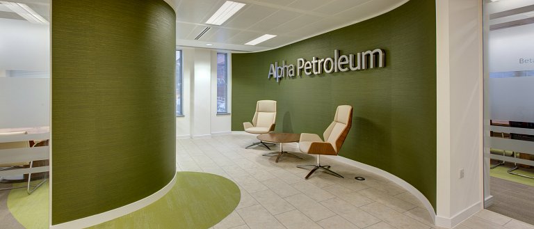 Built-up stainless steel letters mounted on decorative covering on curved walls