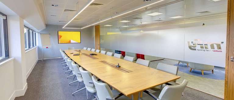 Frosted manifestations applied to the meeting room glass partitioning