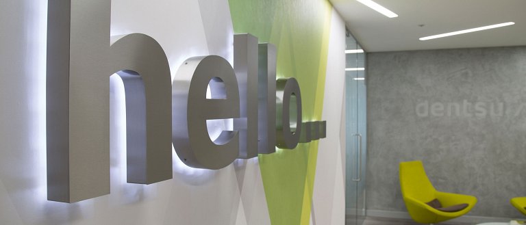 Halo illuminated built-up stainless steel letters spelling 'hello'
