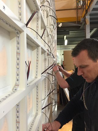 Operations Manager Glen working on an illuminated point of sale display