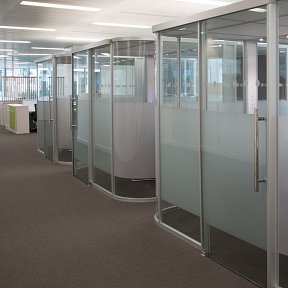 Vinyl frosting applied to glass walls of meeting pods